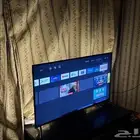 تلفزيون 50 بوصه سمارت 4K HDR نظام اندرويد مع طاوله تلفزيون