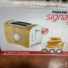 محمصة Nikai بكرتونتها