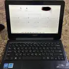 لابتوب اسوس حجم صغير بحالة ممتازة جدا  يعمل بلمس وقابل لطي