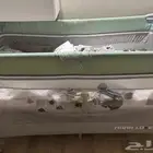 سرير أطفال و عربة أطفال و هزاز كهربائي