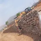 بوكلين بناء الحجر وقص الارضي
