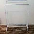 علاقة ملابس وحامل الاحذية