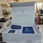 عمل بوكسات هدايا والطباعة عليها وبوكسات جلد وأوشحة