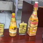 هاند ميد رسم بالرمل في زجاجه السعر بيبداء من 25ريال الي 150ر