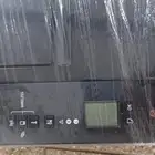 طابعة كانون ملون شبه جديده مع حبر تعبئة اسود