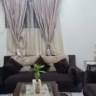 كنب للبيع مع الطاولات والسجاد والشلال