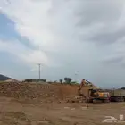 بكلين وقلاب لقص الأراضي وبنيان الحجر وهدم العماير وحفر الآبا
