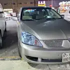 لانسر ميتسوبيشي للبيع الموديل 2009الممشى 500 القير اتمتيك قز