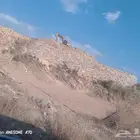 بكلين البنا الحجر وقص الا اراضي وهدد العماير