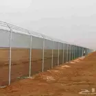 أعمال تسوير وتشبيك بالشبك الزراعي من الحديد المجلفن والعادي.