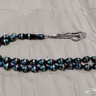 مسباح شبيه يسر مرصع بالفيروز والياقوت الأحمر ومرصع بالفضه