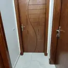 تصنيع ابواب خشب بي شكل جميل تناسب مع ديكور المنزل