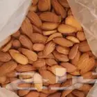 اللوز البجلي بقشر وبدون قسر وزبيب الحماط والعنب المجفف