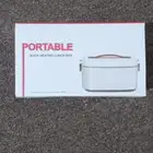 حافظة طعام وسخان كهربائي للطعام.