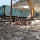 بكلين لقص الاراضي وبناالحجر والردميات والهدم