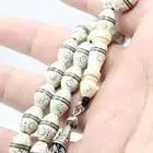 س بحة من الصدف مطعمة بالفضة