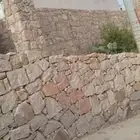 مباني حجر كبير وصغير بل يد وبل معدات