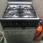 طباخ غاز 4 شعلات ستانلس مع فرن وجره غاز بحاله جيده جدا