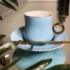 كوب وصحن وملعقه