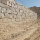 بنيان حجر بوكلين قص اراضي حفريت
