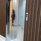 تركيب فريم استانلس ستيل وديكور خشب بديل رخام للمصعد
