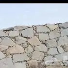 مقاول مباني الجدران الحجر. وردميات تلبيس الحجر