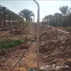 تنفيذ اعمال شبوك المزارع والاراضي البيضاء وزراعت النخيل العر
