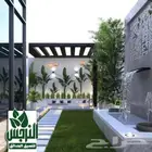 تنسيق حدائق تركيب العشب الصناعي