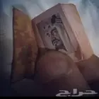 مصحف صغير جدا بصورة الملك فيصل رحمة الله