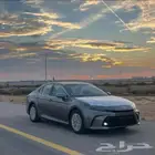 كامري E بلص هايبرد لون تيتانيوم كاش وأقساط