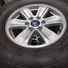 New model Ford rims original With Shawaheen tires date 25