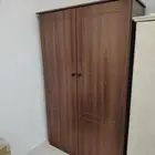 One and a half person wardrobe with a nightstand