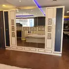 غرفة نوم ملكيه فخمة اضاءه بجهاز تحكم