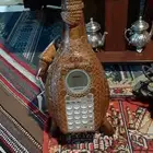 تلفون صناعةيمنيةمصنوع من شجرة الدبه قرع.شغال كاشف ومكبر صوت