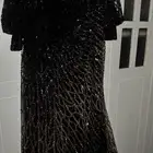 فستان اسود وذهبي فخم من اكشن درس