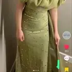 فستان سهره وردي و اخضر من مصممه