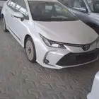 تويوتا كورولا 2025 XLI جنوط فتحة سقف ابيض 2000cc