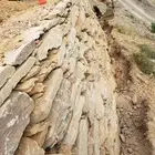 بوكلين لقص الاراضي وبناالحجر