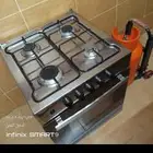 فرن مع أنبوبة غاز ومنظم