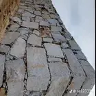 مقاول جدارات حجر وسواق بوكلين للحفريات