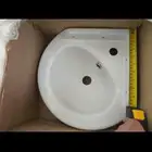 حوض مغسلة يد بقراطيسها