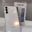Galaxy 16 phone clean with its charger case and headphones n