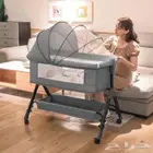 سرير مواليد بجوار الام