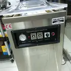 مكينة تغليف وشفط الهوا