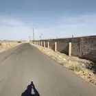 للبيع أرض في بيشة على الطريق العام الرابط بين بيشة ورنية