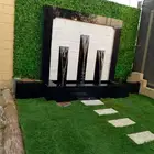 شلالات ونوافير وعشب صناعي وثيل طبيعي