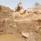 بوكلين لبناء الحجر وقص الاراضي