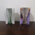 كأسين زجاجين لشركة كوكاكولا بإصدارين مختلفين قديمين ..