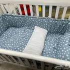 سرير أطفال ينفتح على سرير الأم