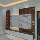 تفصل غرف نوم وتركيب كرات خشبية والتنجيد ودهان الأبواب